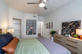 Bedroom with bed and comforter at Grand Villas at Cinco Ranch, Katy, TX
